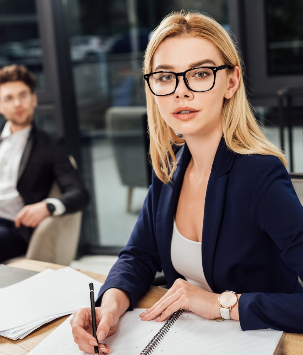 selective-focus-of-businessman-looking-at-businesswoman-in-eyeglasses-that-looking-at-camera-at.jpg